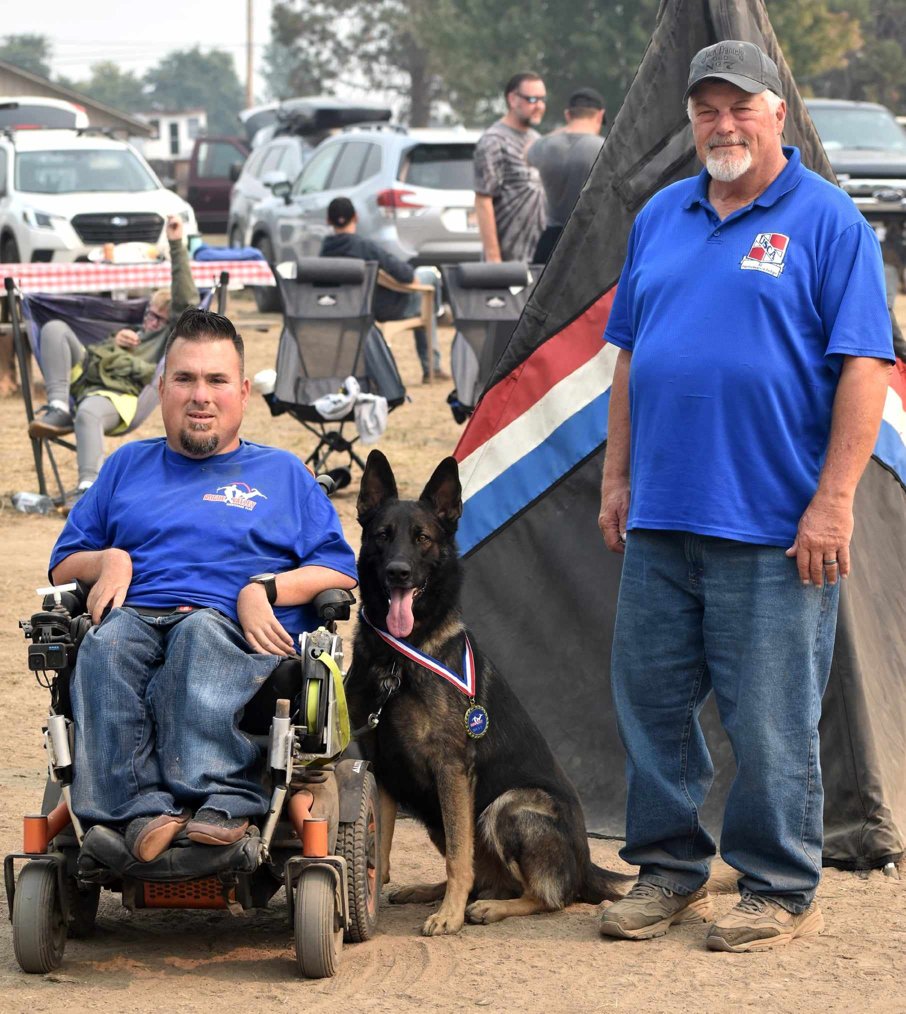 Jason Lake with working dog Driven at a BH title event
