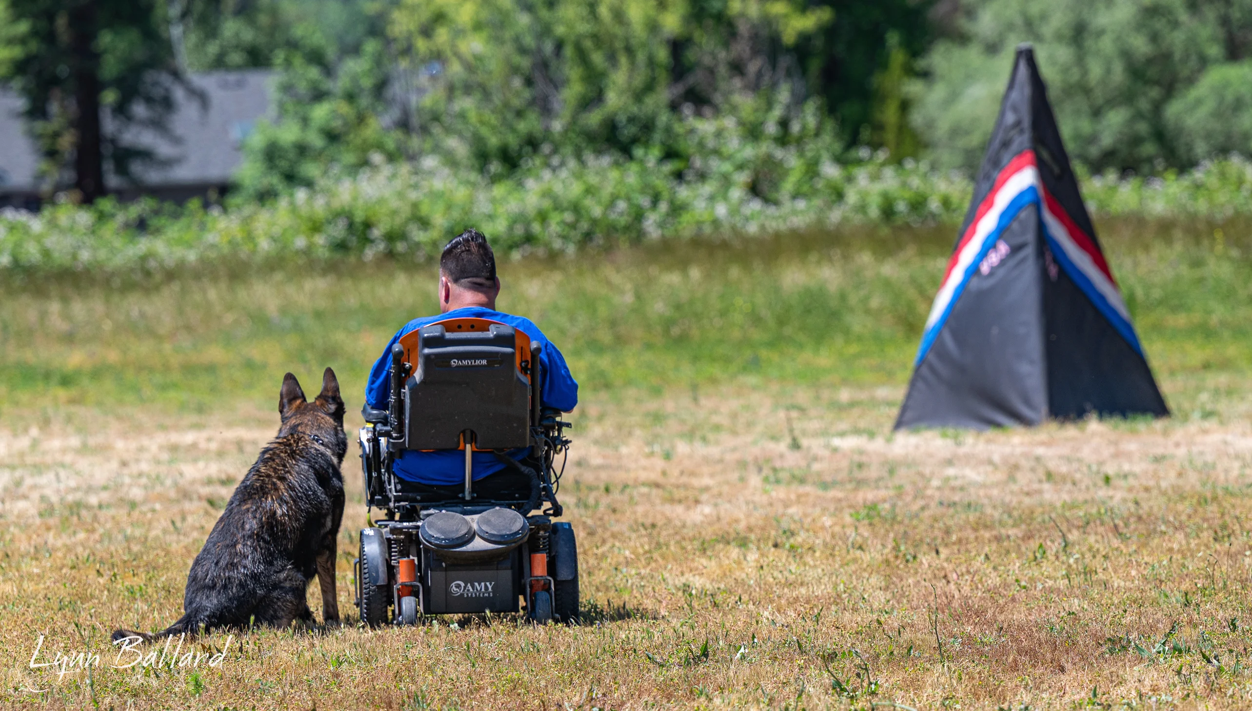 Jason Lake coaching calm working-dog control near an IGP protection blind