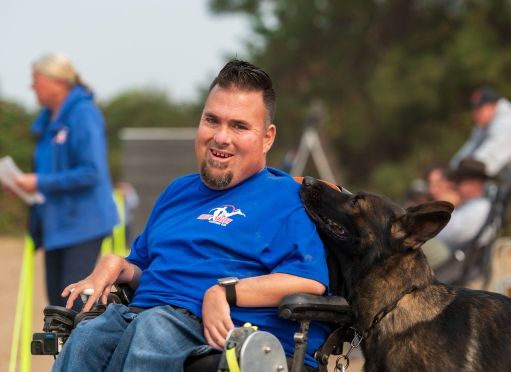 Jason Lake building engagement with a working dog