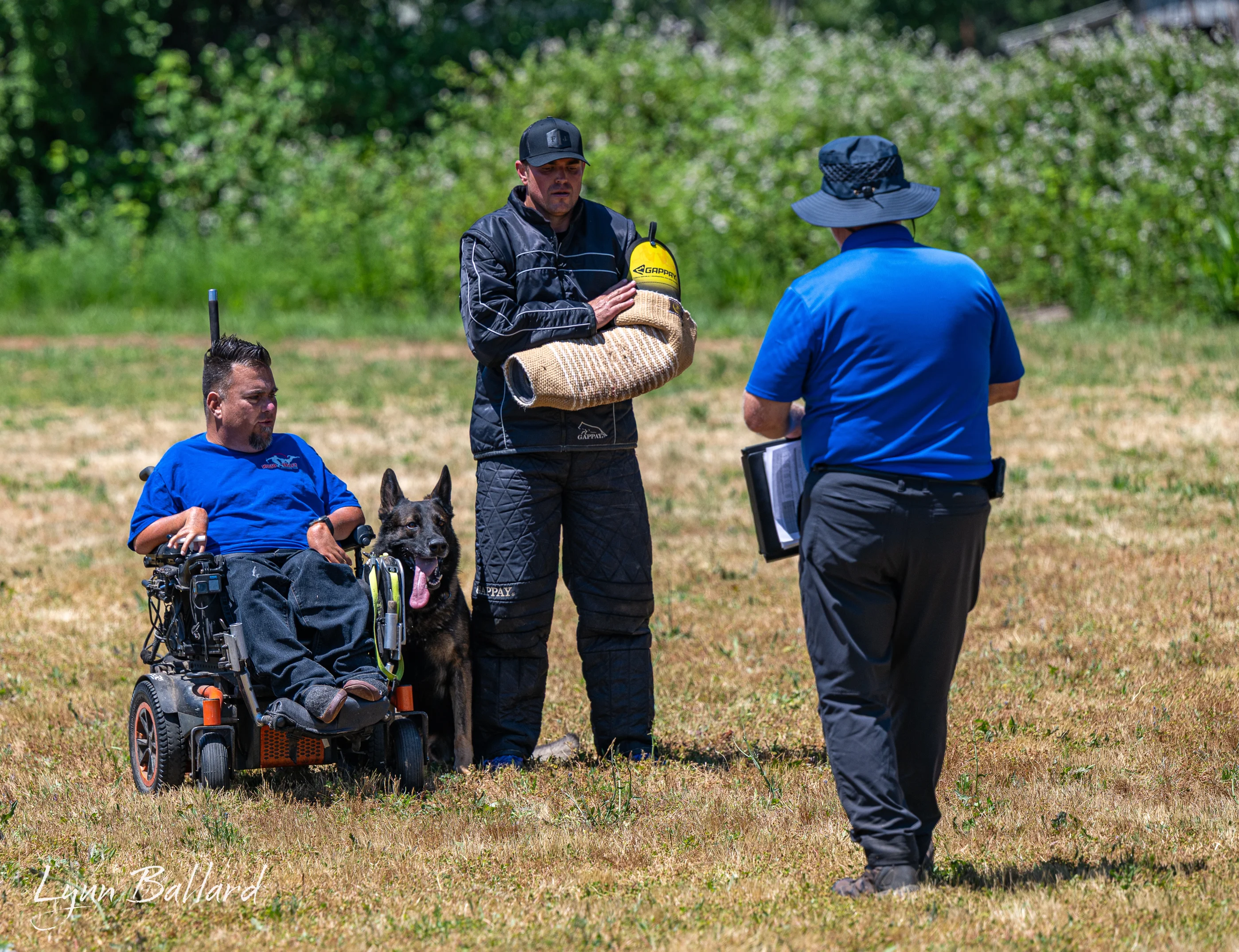 Jason Lake handling a working dog during field training