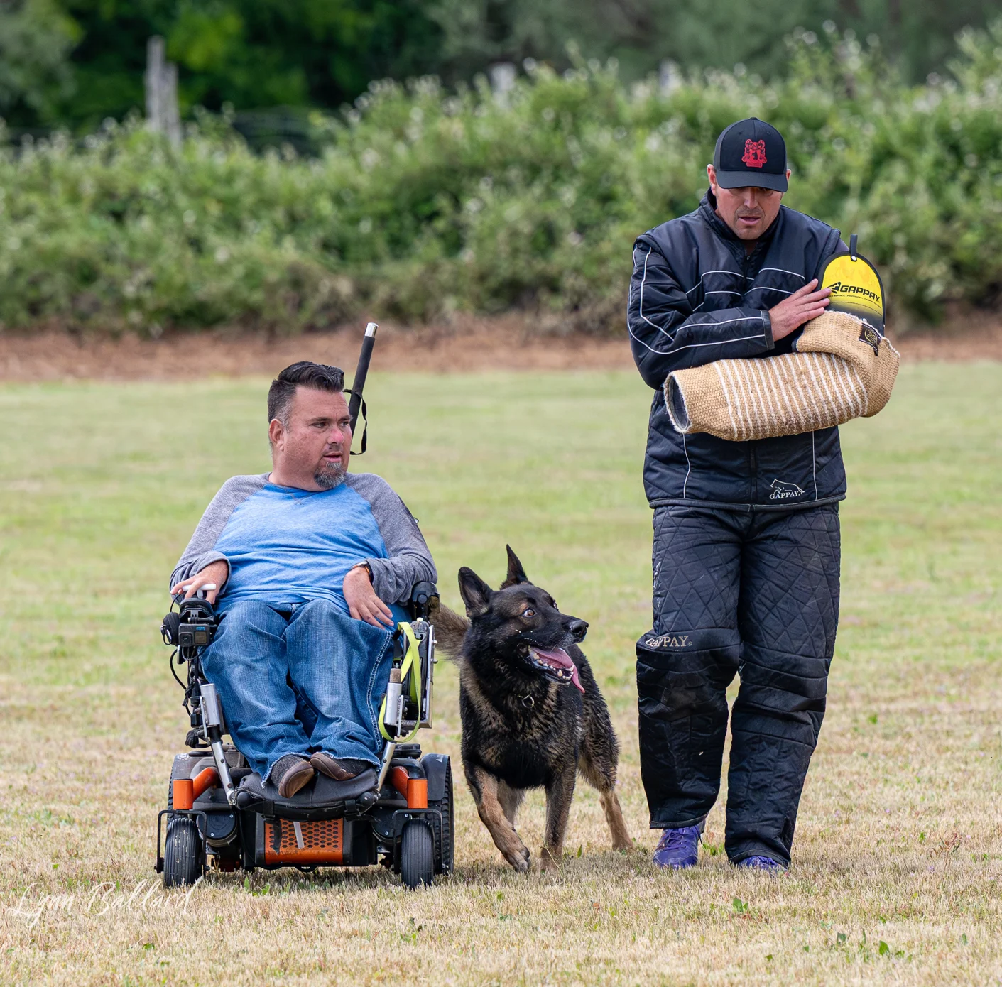 Jason Lake maintaining control of a working dog after a protection exercise