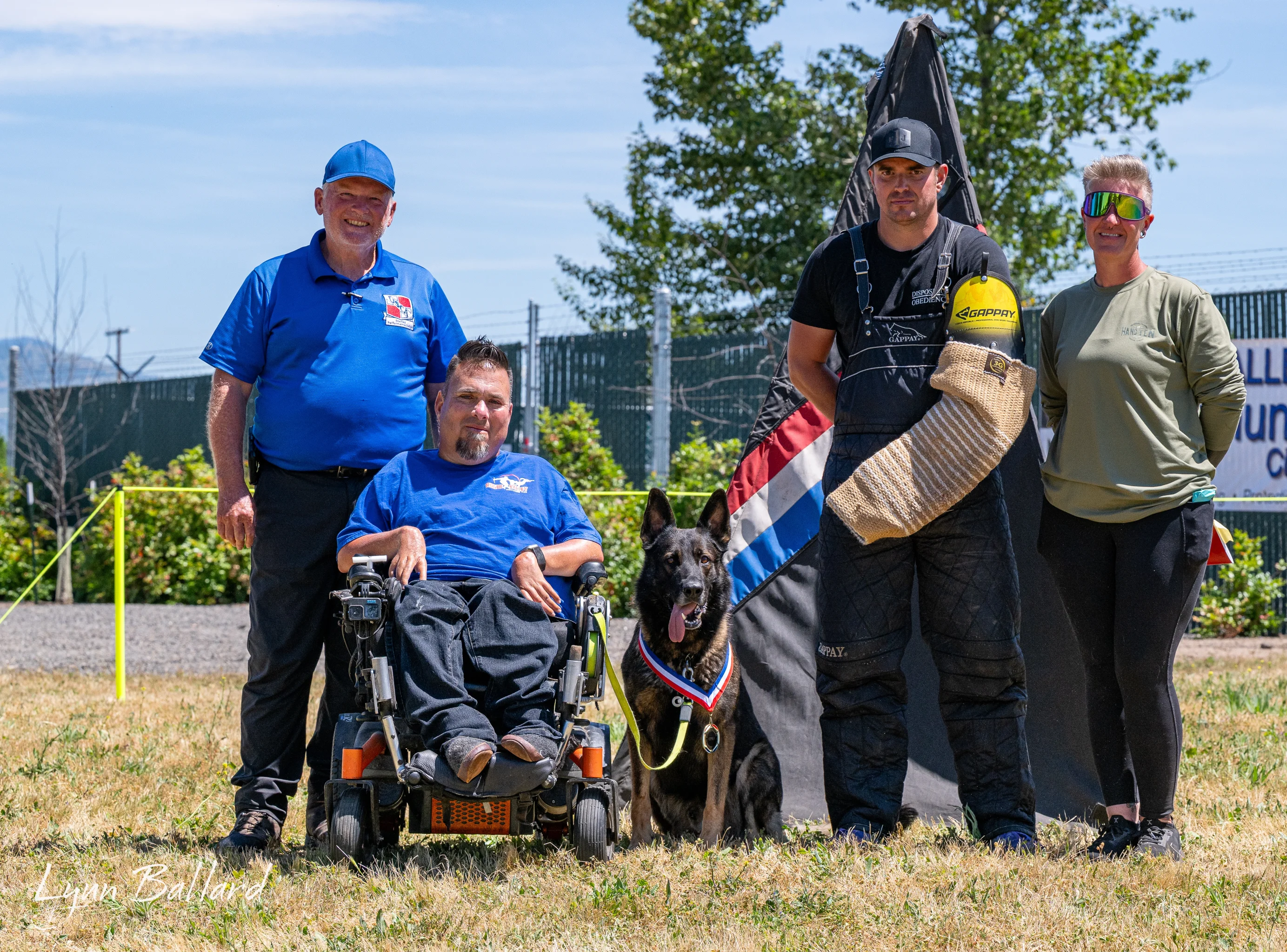 Jason Lake with working-dog handlers and awards at an IGP trial